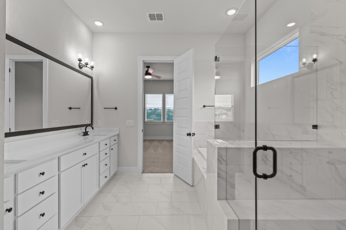 A bathroom with a glass shower.