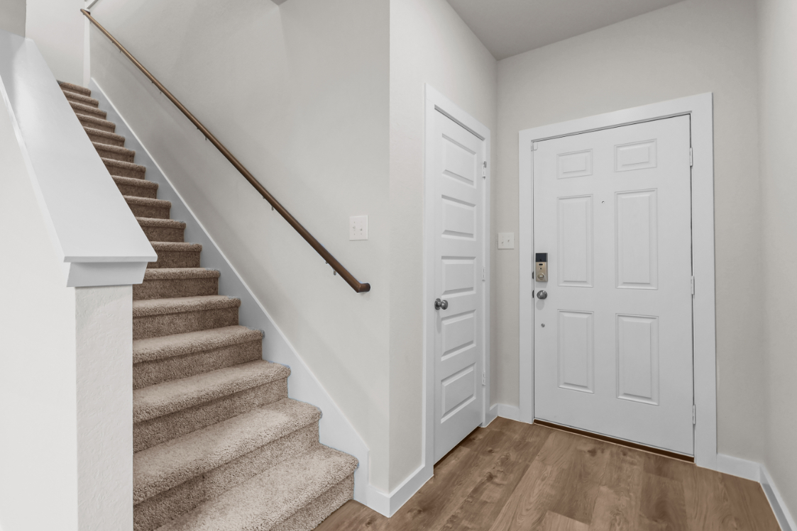 A staircase leading to a door.