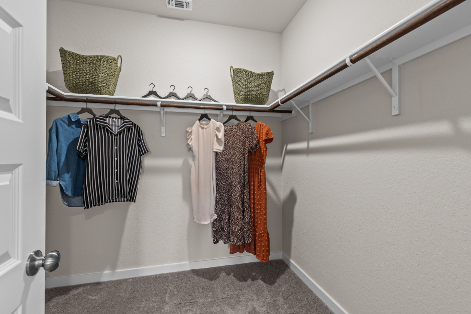 A row of towels on a rack in a bathroom.