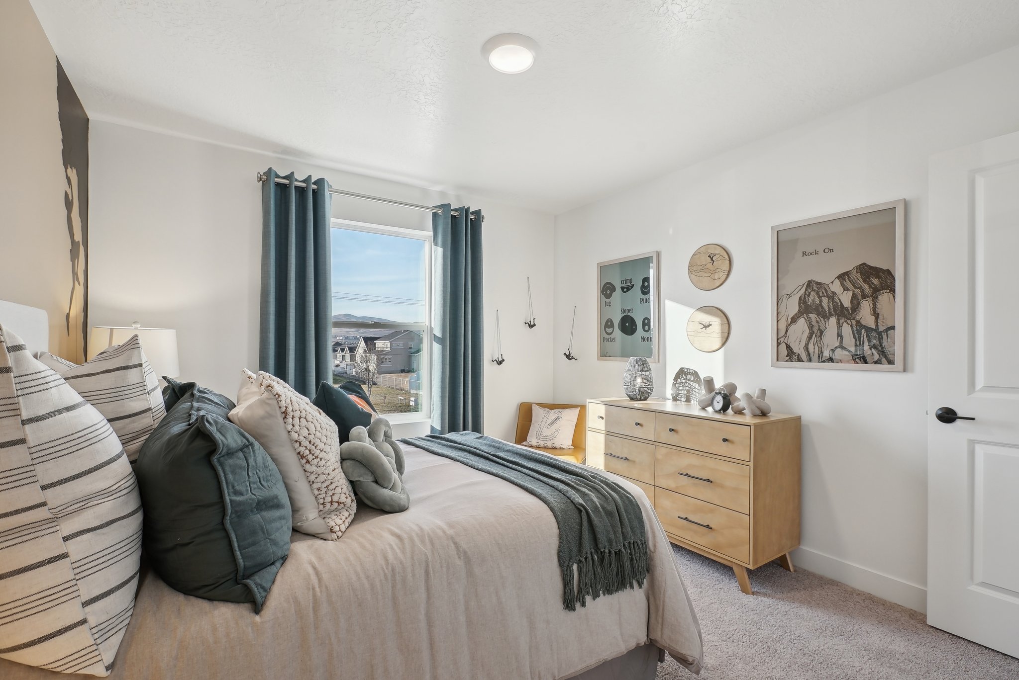 A bedroom with a bed and a window.