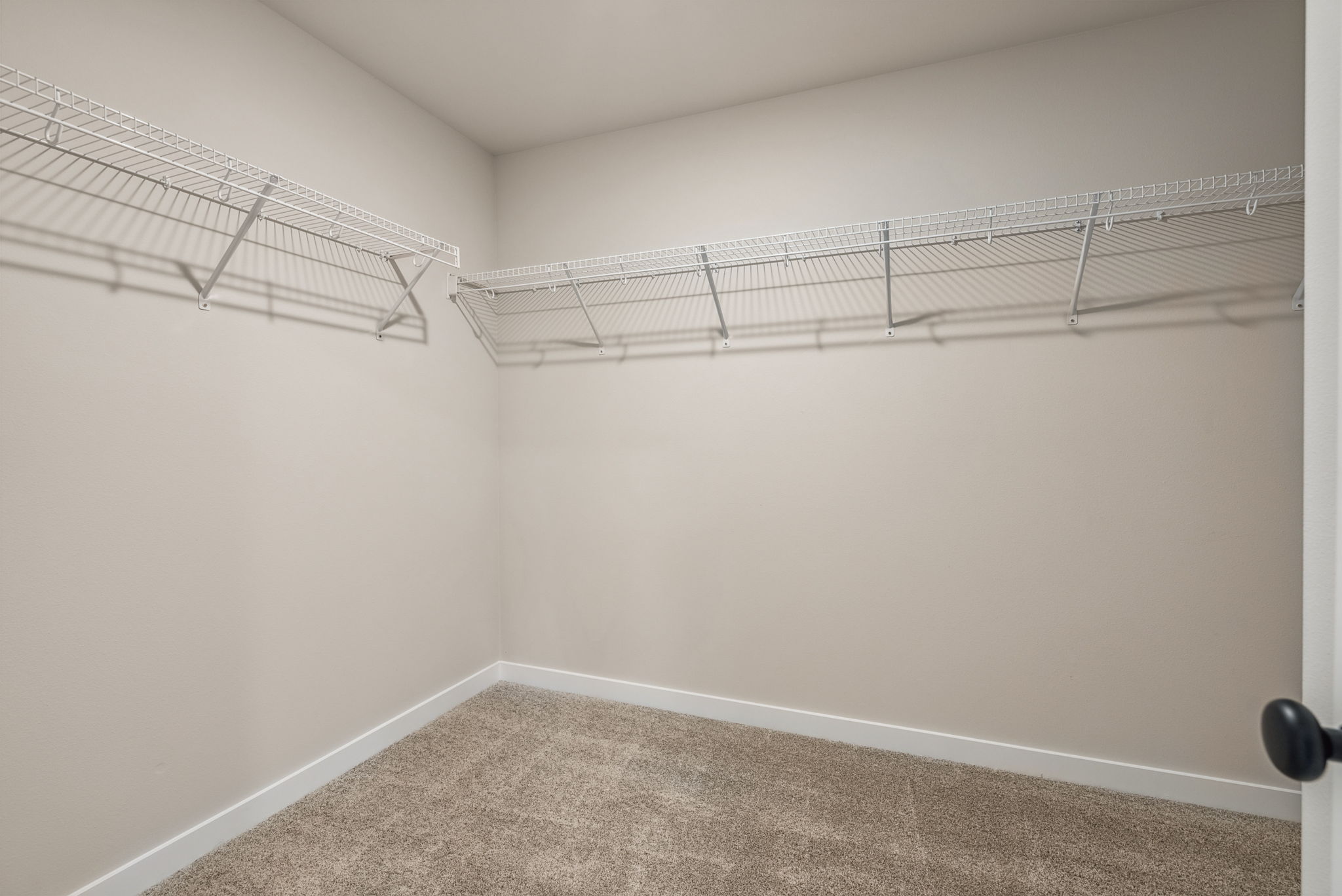 A white wall with a metal frame.