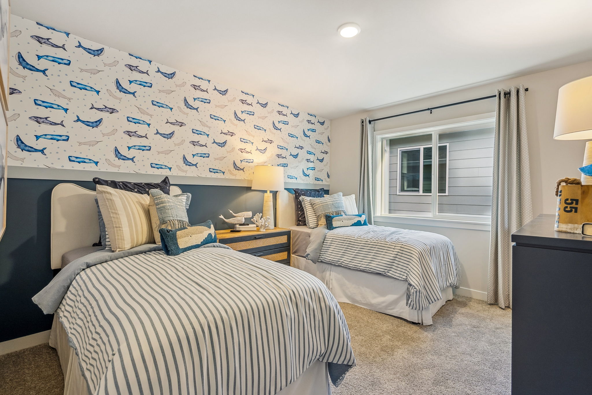 A bedroom with two beds.