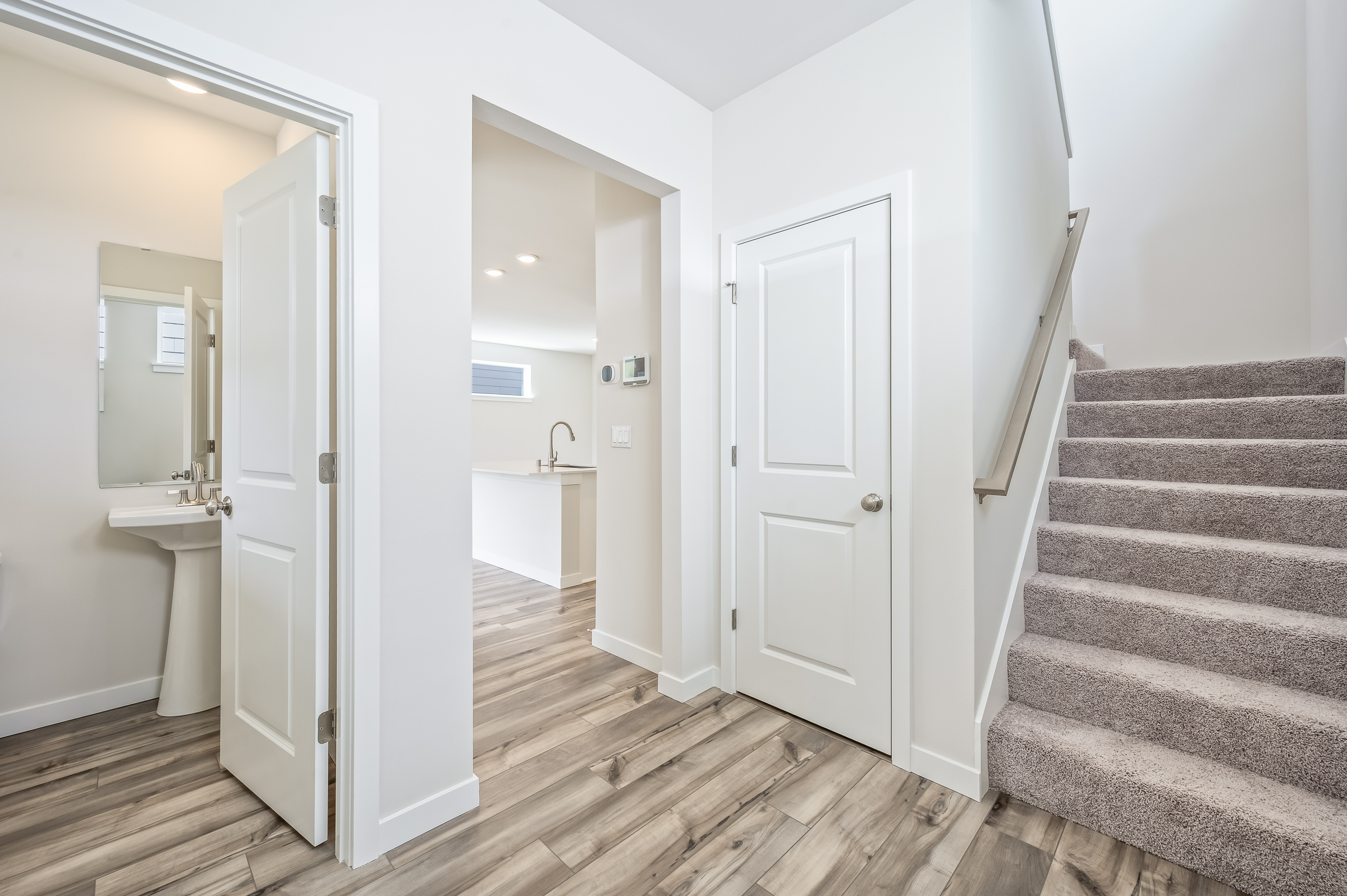 A bathroom with white doors.