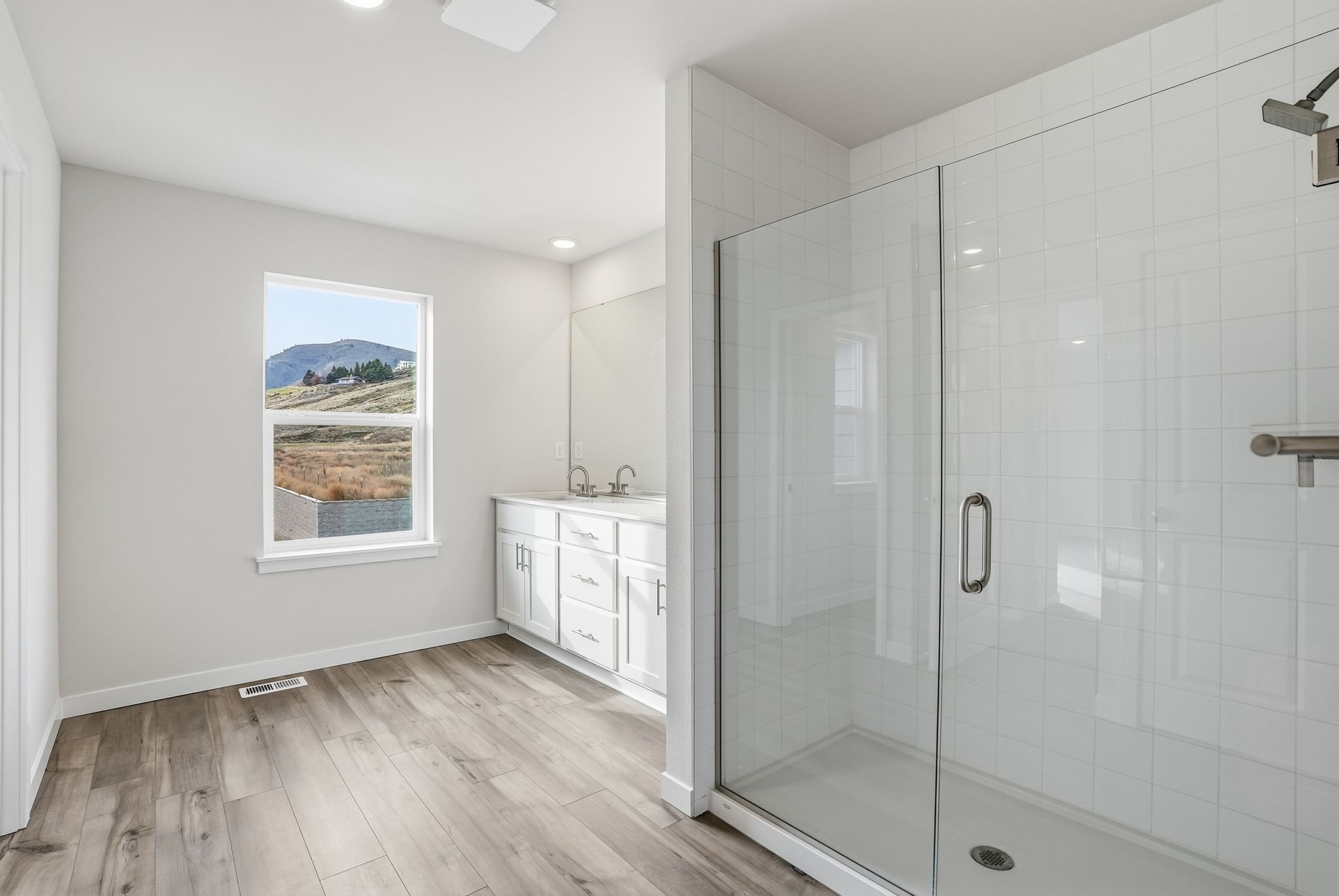 A bathroom with a glass shower.