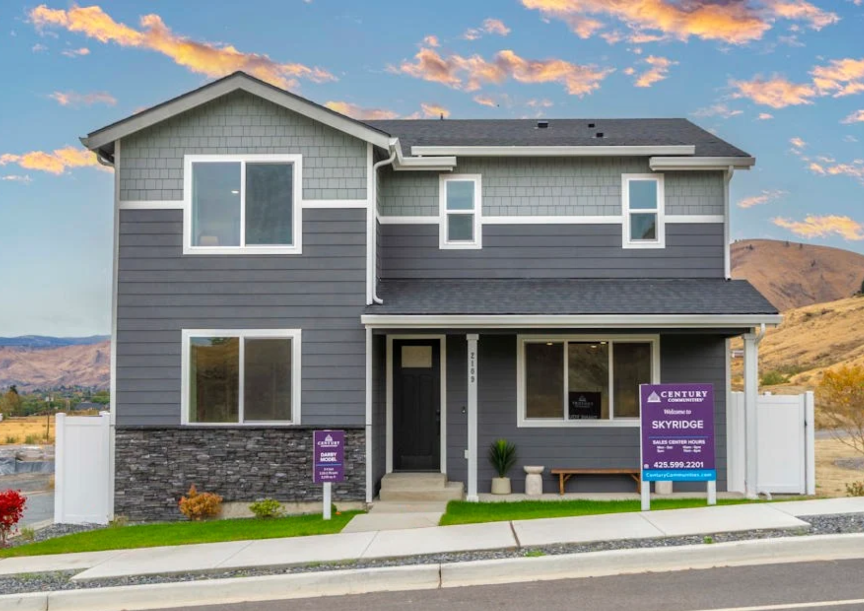 A house with a sign in front.