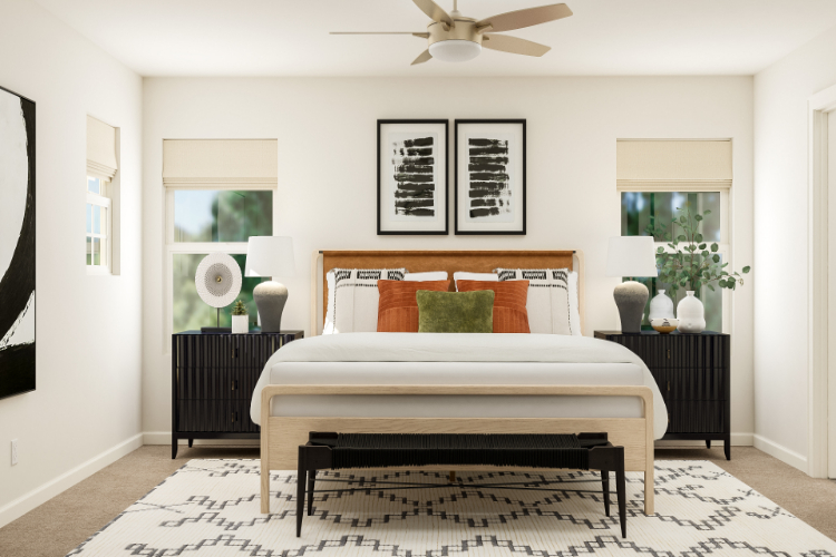 A bedroom with a bed and a fan.