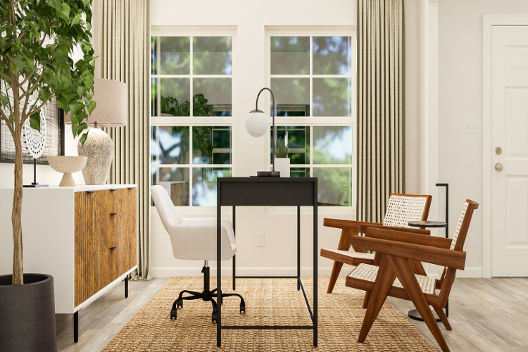 A room with a table chairs and a window with a plant.