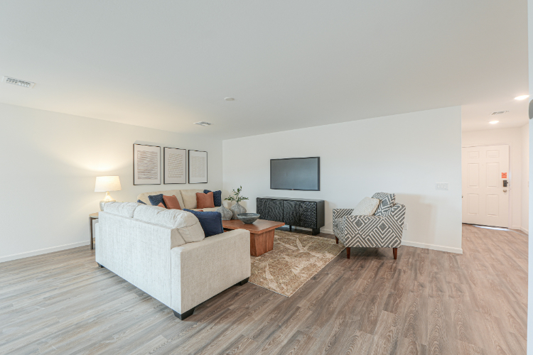 A living room with a wood floor.