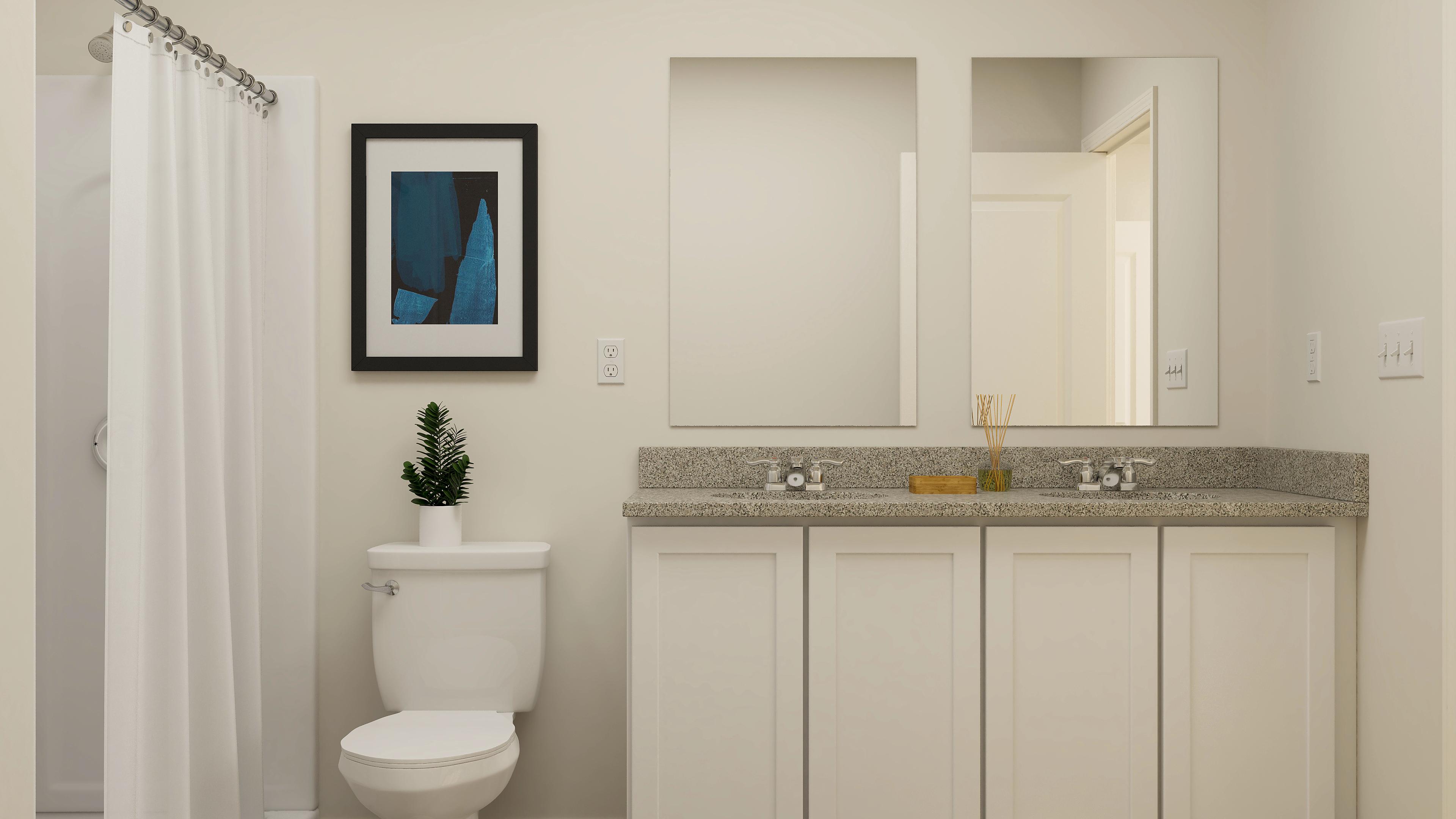 A bathroom with a marble countertop.