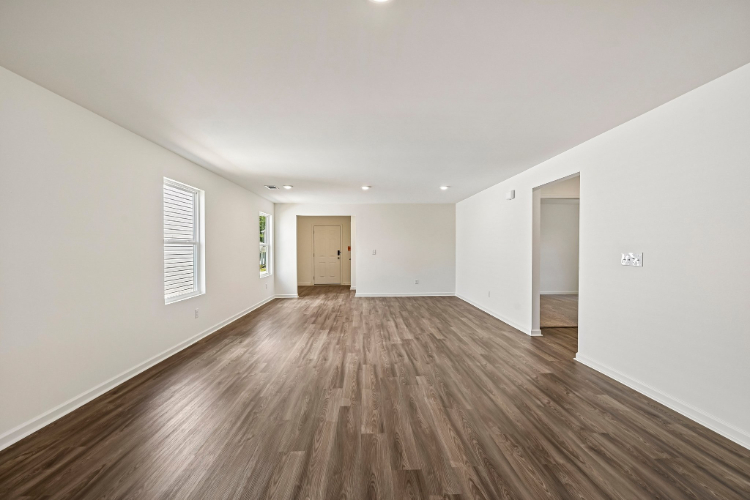 A room with a wood floor and a wood floor.