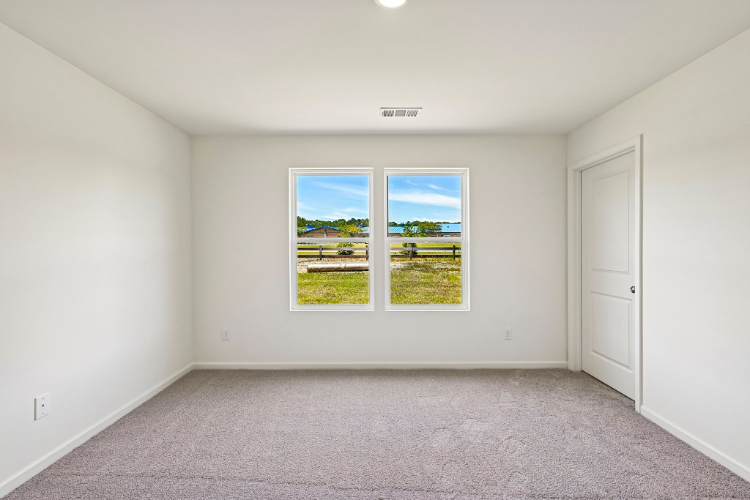 A room with a window and a door.