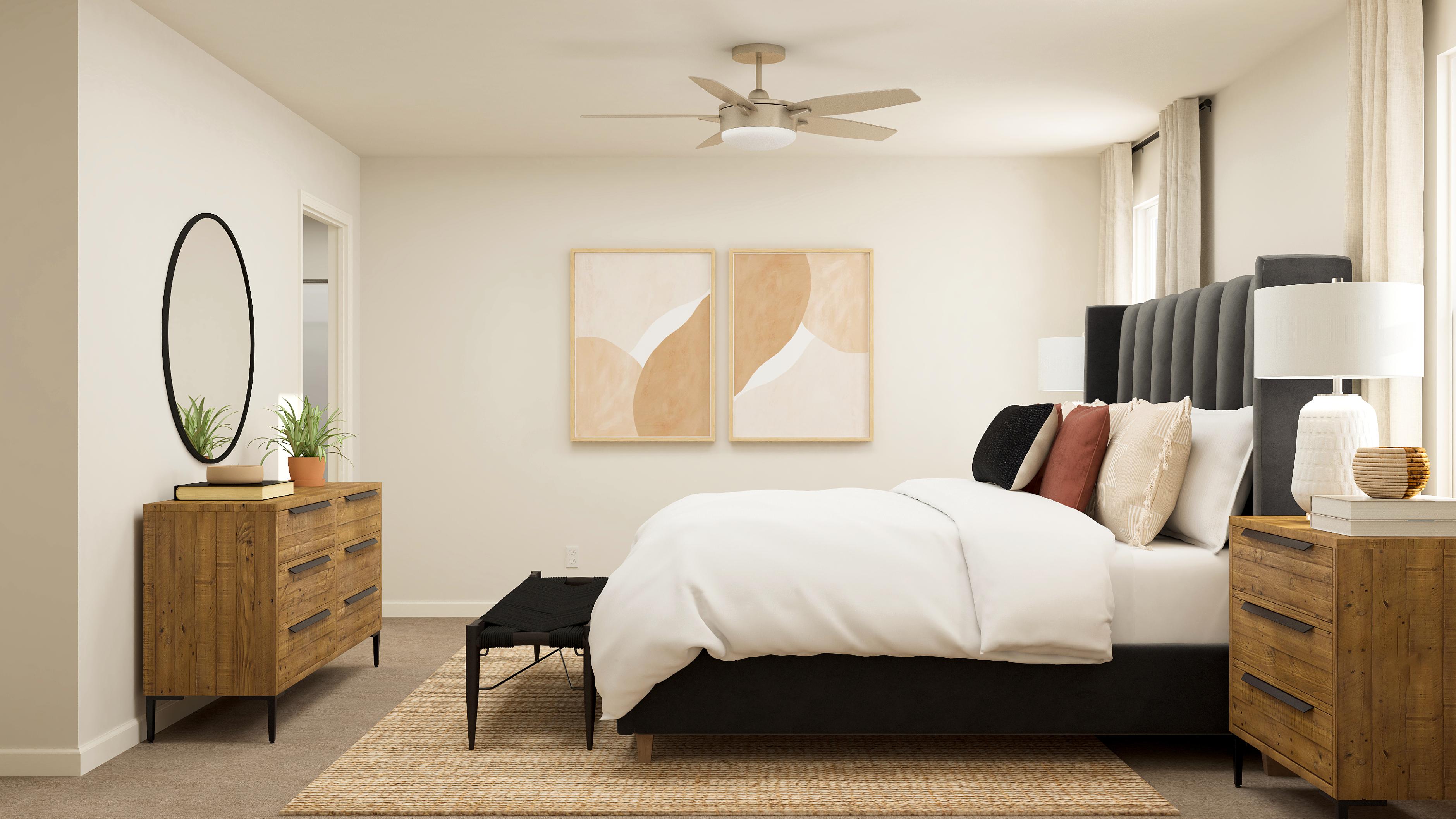 A bedroom with a bed and a fan.