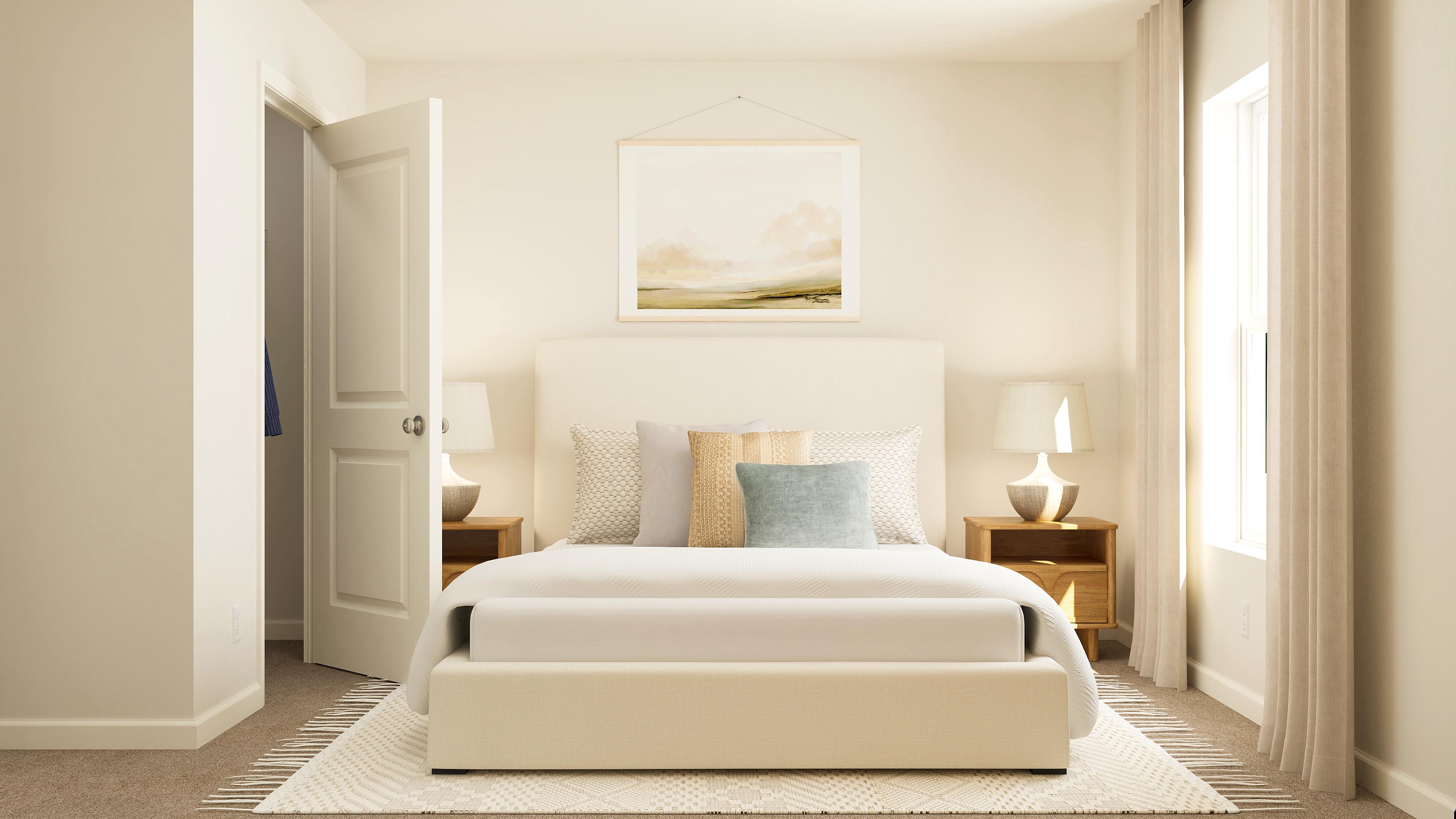 A room with a bed and a lamp.