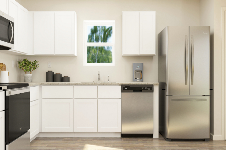 A kitchen with white cabinets.