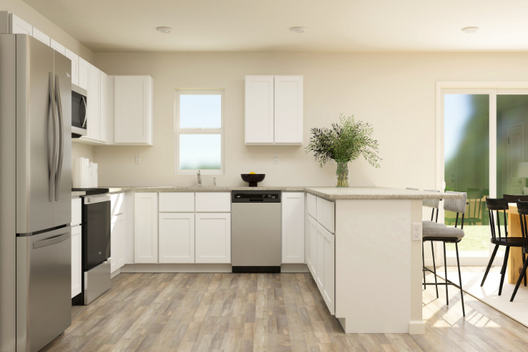 A kitchen with white cabinets.