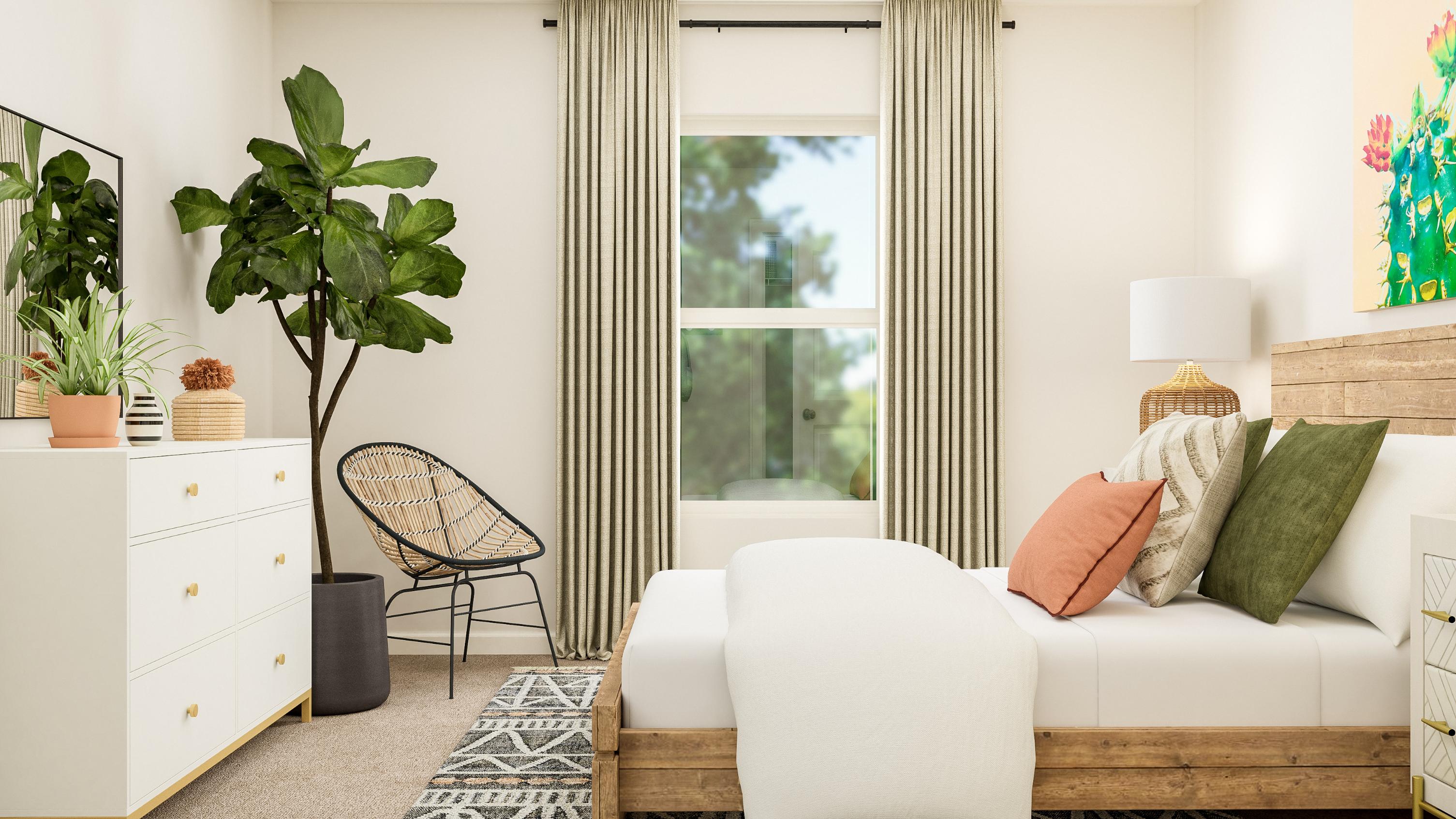 A living room with a white couch and a chair.