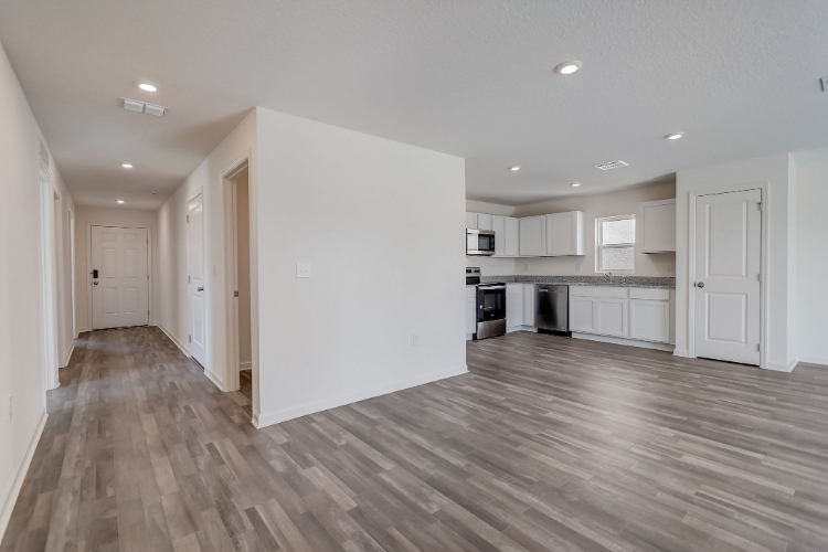 A large kitchen with white cabinets.