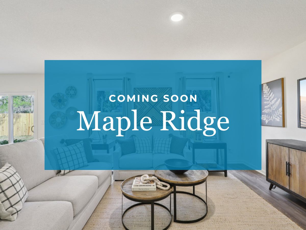 A room with blue couches and a table.