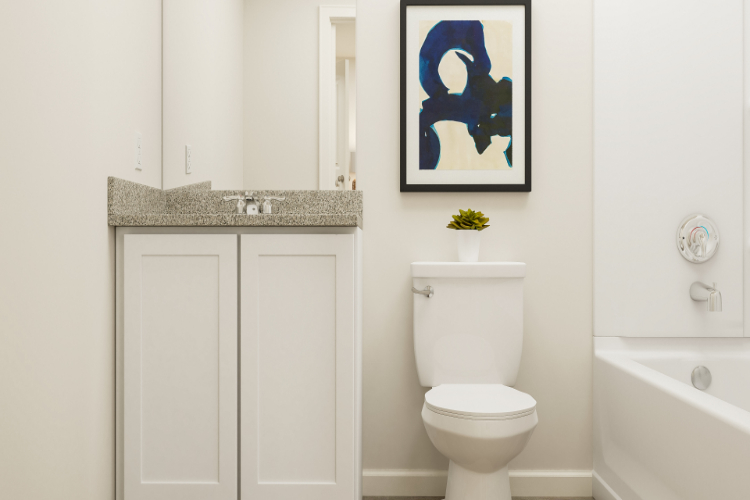 A bathroom with a toilet and sink.