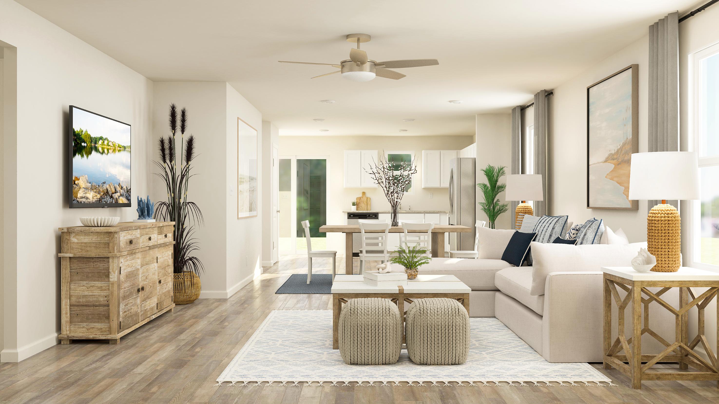 A living room with a white couch and a table.